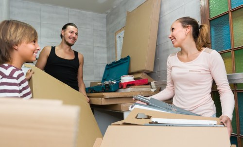 House removals planning in Newmalden with packed boxes and moving supplies