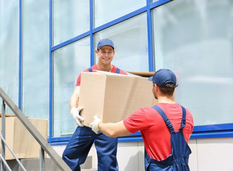 Professional removals and storage service in Newmalden with moving boxes and a removal van