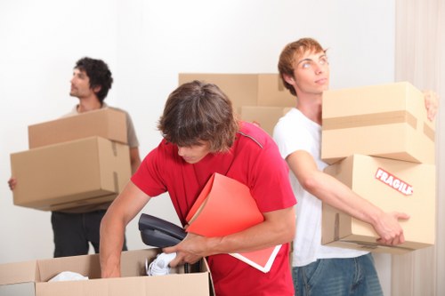 Packed boxes and furniture organized inside a Newmalden storage unit