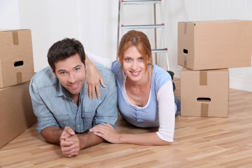 Professional movers handling furniture during a small removals job