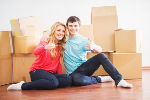 Professional movers loading furniture for a Newmalden relocation